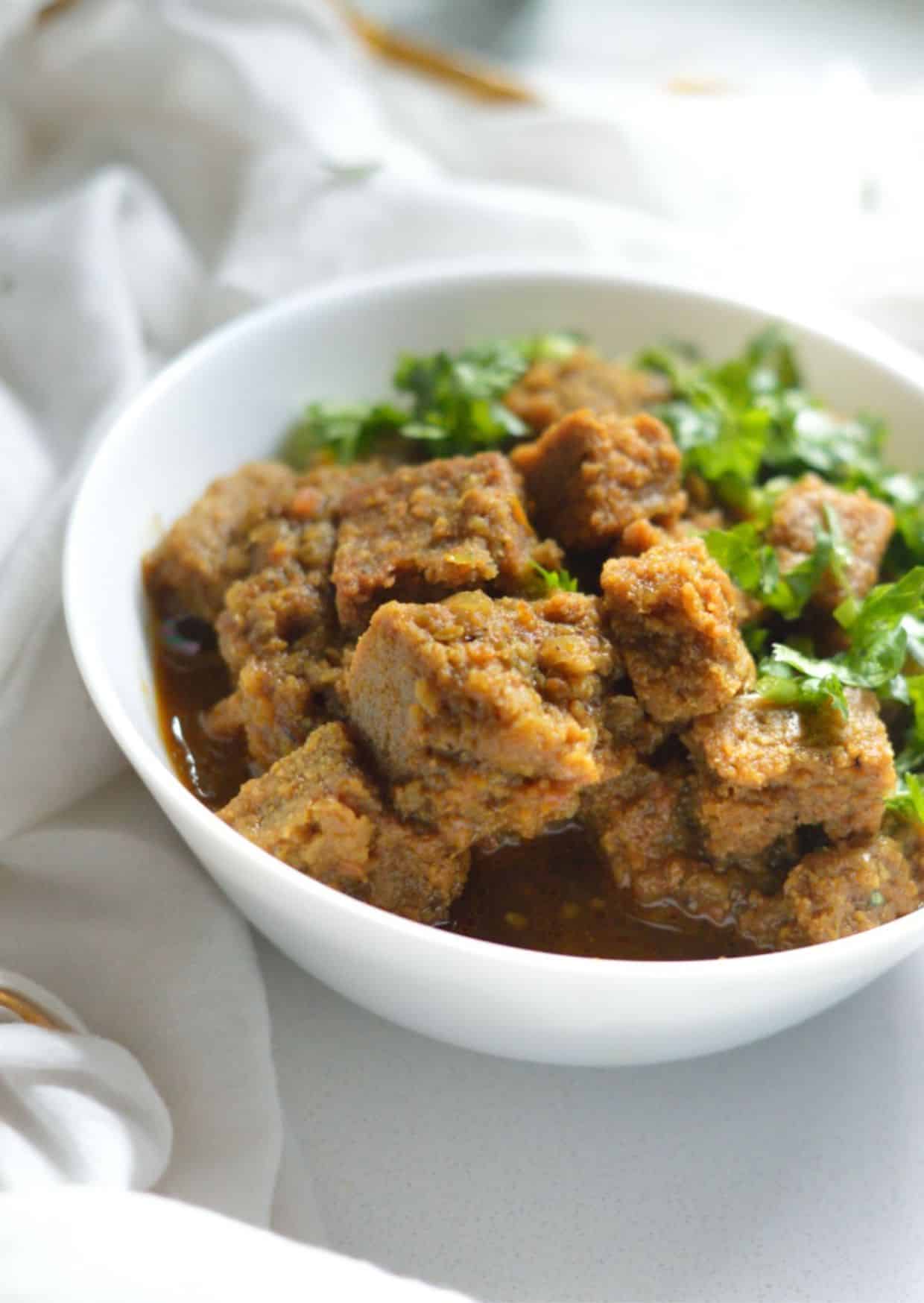 Dhoka Dalna dish in a white bowl.