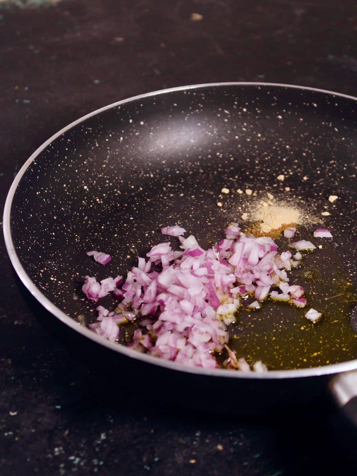 add chopped onions and garlic powder in a pan and saute 