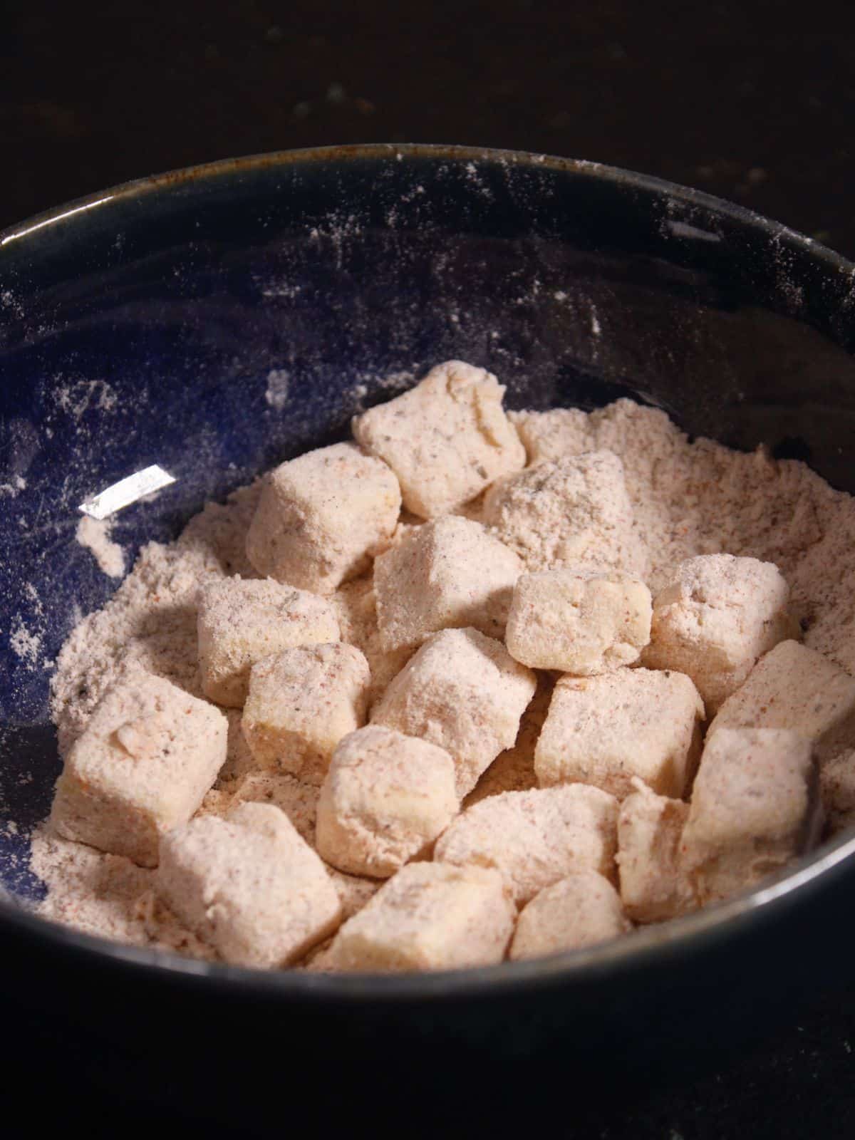 coat the paneer cubes with the powdered coating 